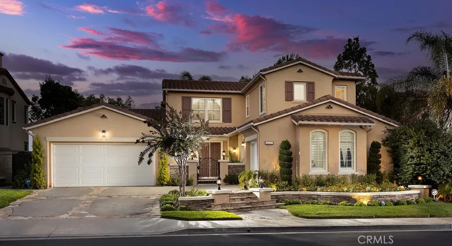 Gorgeous Street Presence with Stone Walkways and Custom Lighting as well as a Gated Entry Courtyard!