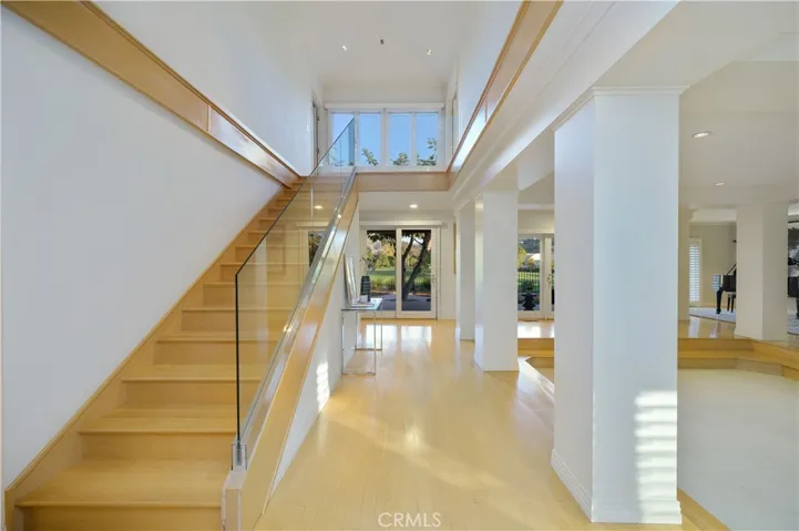 Foyer Main Staircase. 2nd Staircase off Family Room & Kitchen
