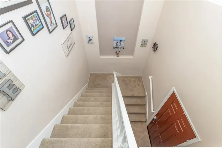 Staircase leading from the front door to the main living area