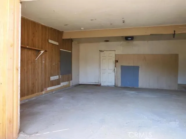 Work sshop interior, west side.  Door at back goes to the back yard and to a storage room
