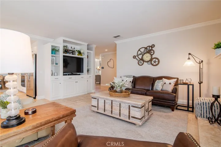 Family room with entertainment center and crown molding.