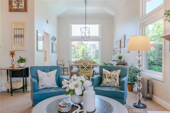Living room with formal dining room. Beautiful picture windows.