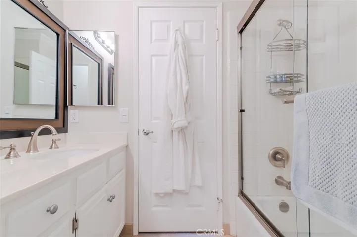 Guest bathroom with shower and tub located upstairs.