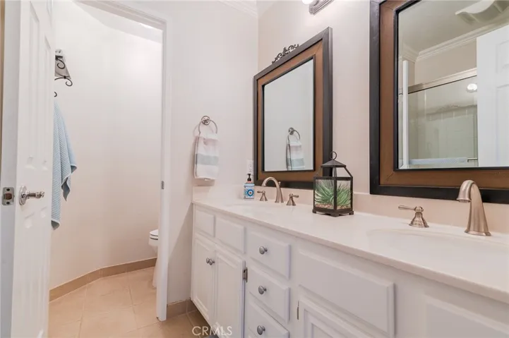 Guest bathroom with dual vanity.