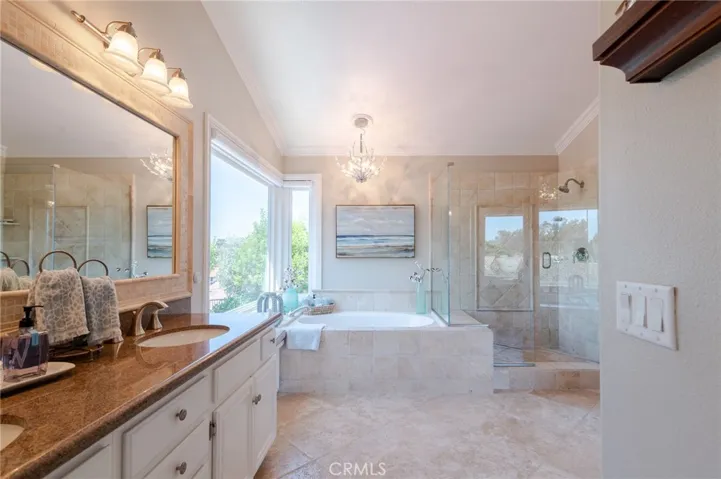 Gorgeous, upgraded master bathroom with dual vanity and quartz countertops.