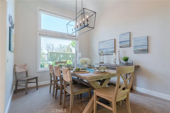 Formal dining room with view of the backyard.