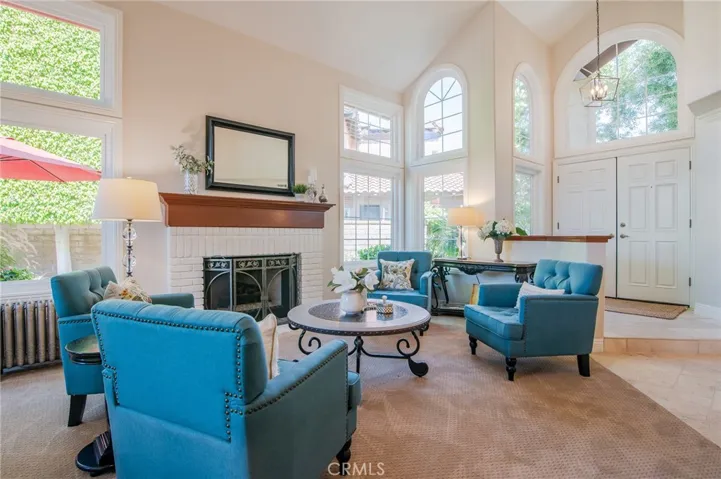 Living room with fireplace and lots windows