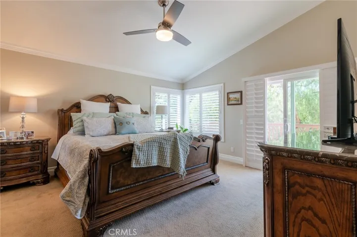 Gorgeous master bedroom with a balcony.