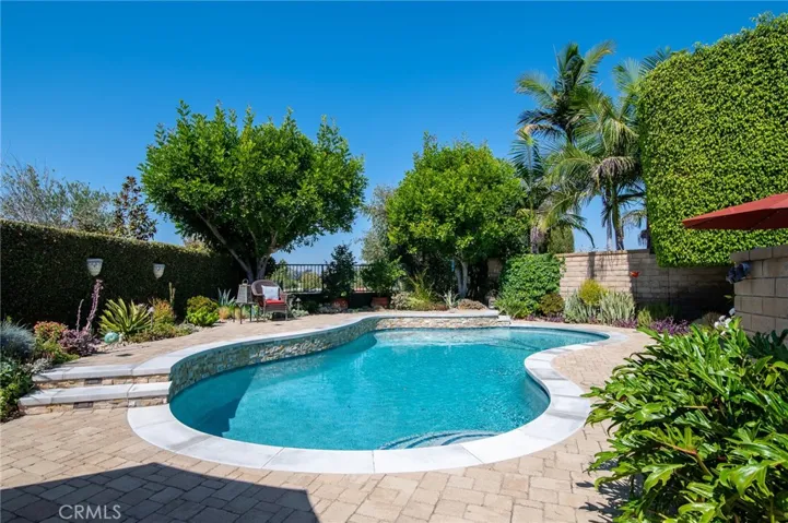 Enjoy entertaining in the private backyard with a pool and view!