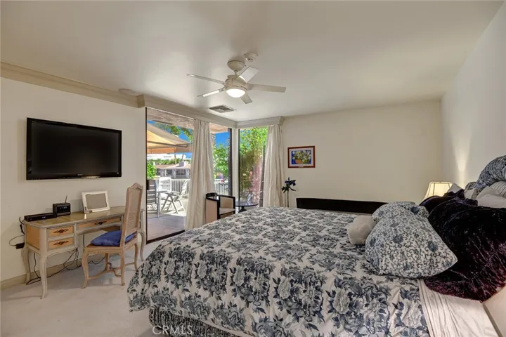 Primary bedroom and view out to back patio