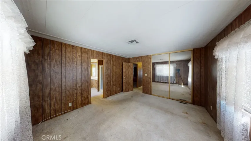 Master wall closet with mirror doors