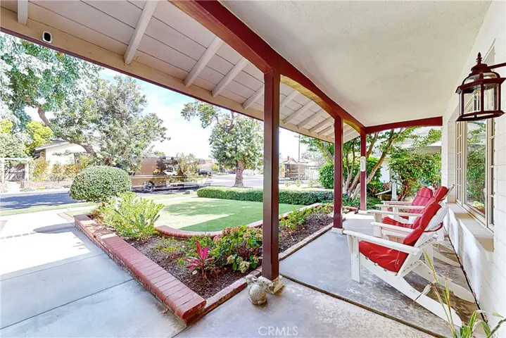Front porch overlooking Tiger Turf lawn and quite street
