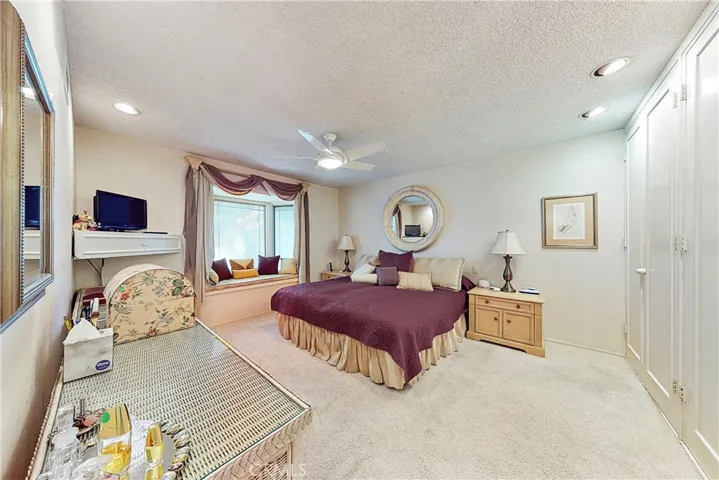 Master bedroom with a bay window with window alcove