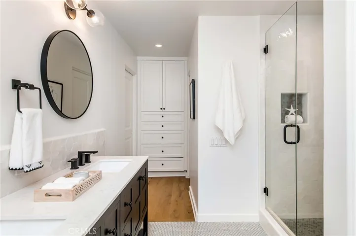 Primary bathroom with built-in storage and walk-in master closet.