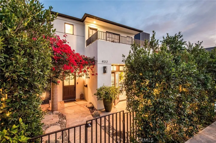 Welcome to this modern, coastal home just steps to the sand.