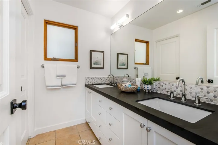 Full bathroom serving the two bedrooms on second level.