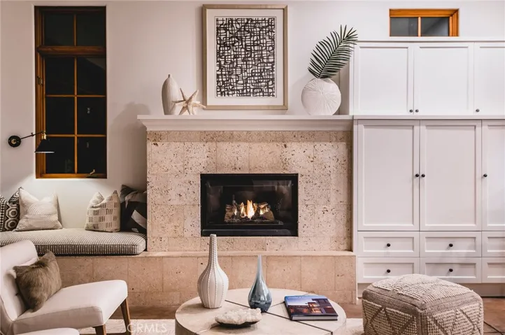 Curl up in front of the ocean-inspired fireplace.