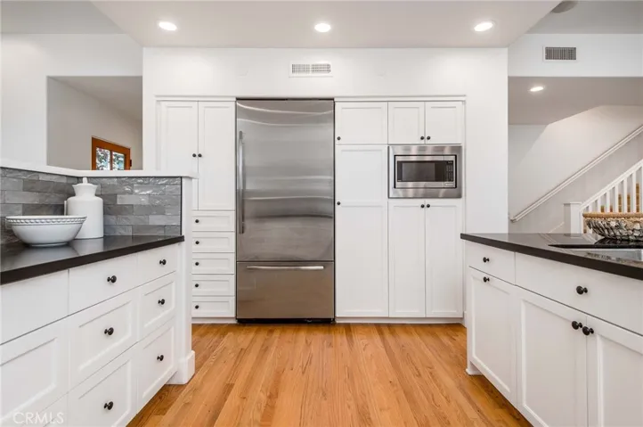 Countertop space and cabinet storage for days.