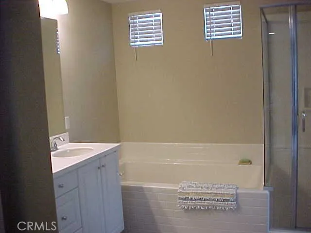 Master Bathroom with Separate Tub and Glass Shower Enclosure