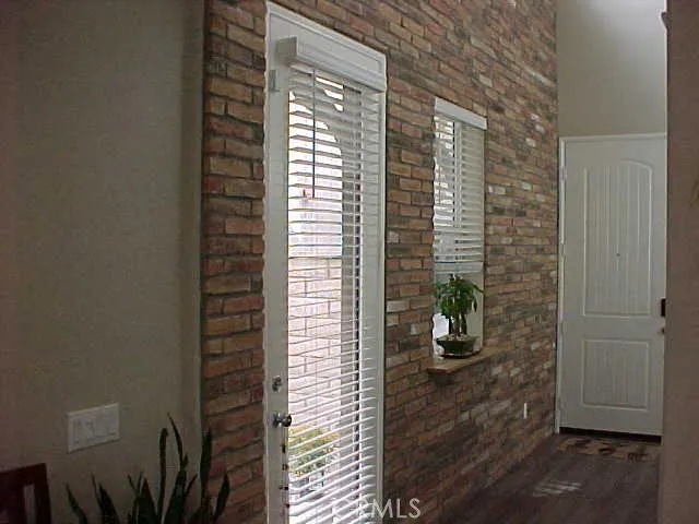 Brick Feature Wall in Entry and Side Yard Access Door