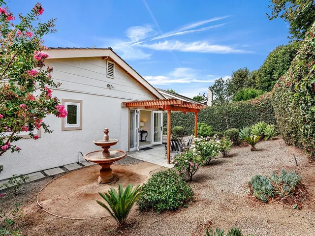 The backyard garden features drought-tolerant plants.