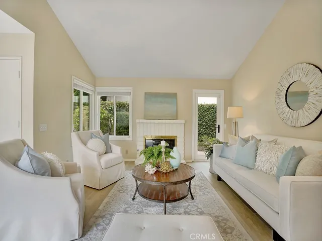The spacious and bright living room greets you.