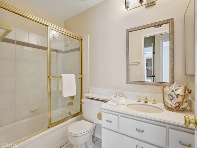 The hallway bathroom features a tub/shower combination.