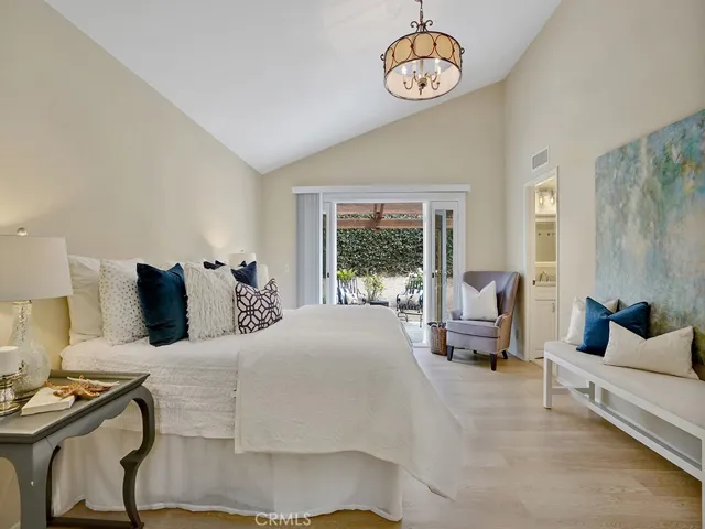 The primary bedroom opens to the backyard garden.