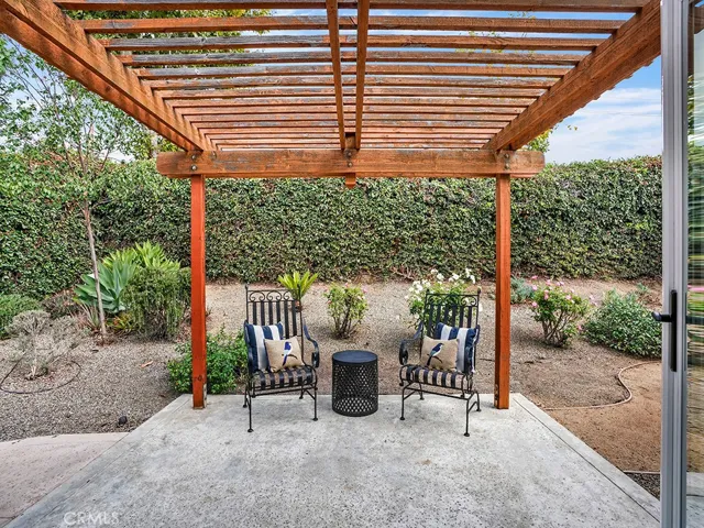 The inviting backyard garden provides a lovely area to sit outside and enjoy the outdoors.