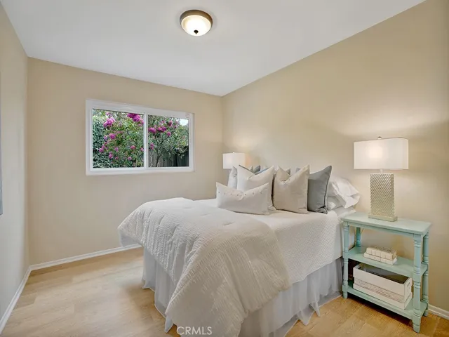 Bedroom 2 overlooks the backyard garden.