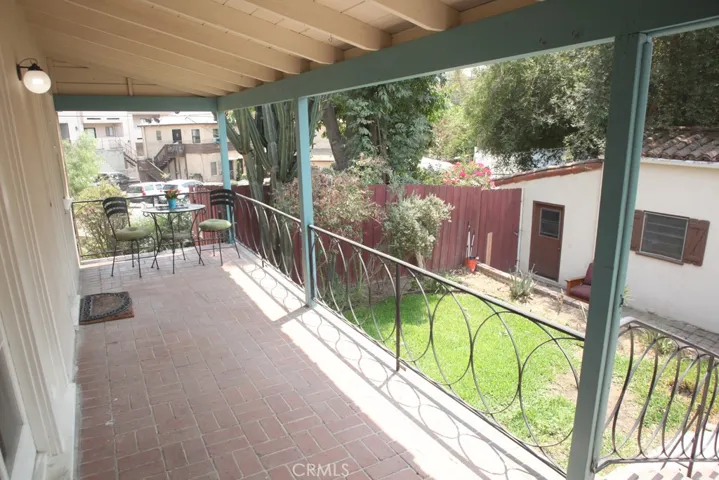 Covered Veranda and Shot of Bonus Building
that has 3/4 bath, two rooms, meal area, etc.
