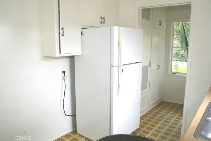 Another view of Galley kitchen with view of
utility hot water and pantry doors.