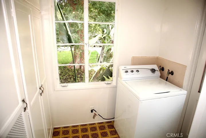 Utility Room - Dryer in garage for now. Door on right
leads outside.  Electric panel in this room.