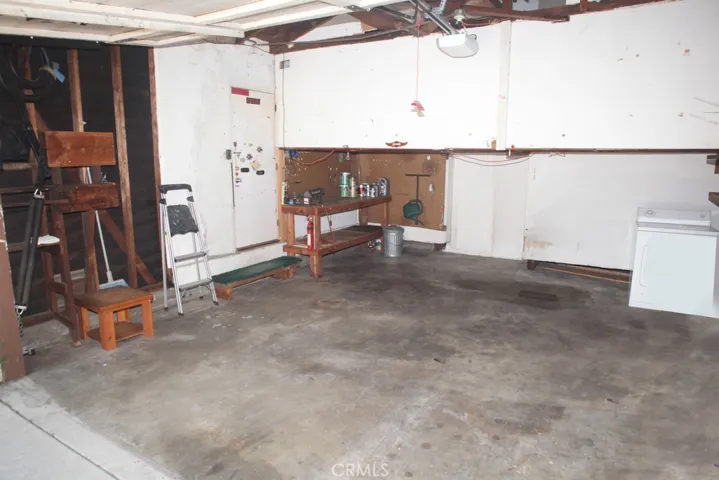 Attached double garage with workbench, working dryer plus access to house.
More storage and automatic opener!