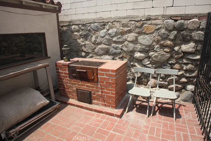 BBQ next to Patio.  Iron gate leads to
side of house.