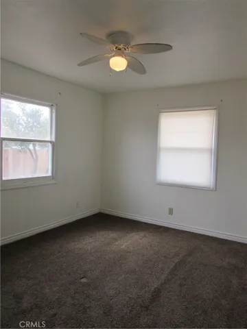 The other two bedrooms have carpet and ceiling fans w/ a walk through shared closet