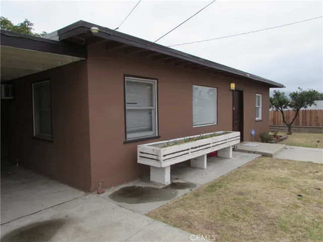 Front of the home has a planter.