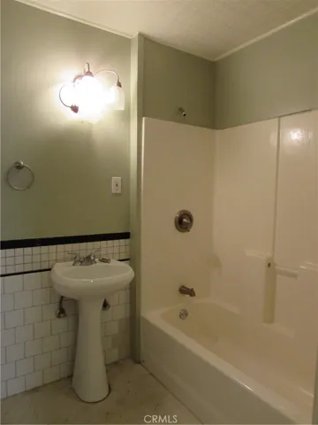 The other two bedrooms have carpet and ceiling fans w/ a walk through shared closet