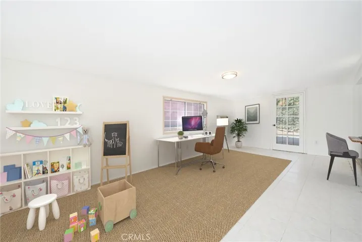 Another example of a setup for this space: Virtually staged as a work-from-home/ kids play area set-up.