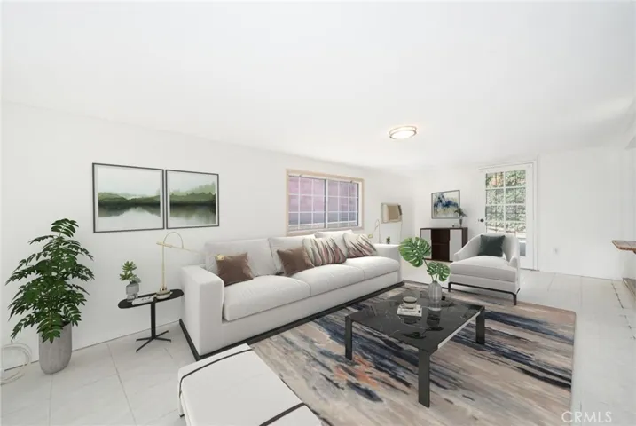 Virtually staged family room (The addition area). Doors on both sides leading to the back patio or side yard.