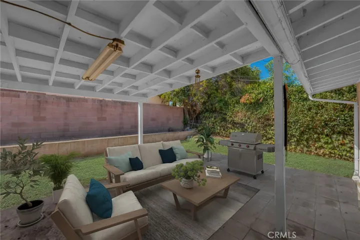 Patio virtually staged/painted. Backyard with 2 Taiwanese guava trees, 1 loquat tree.
