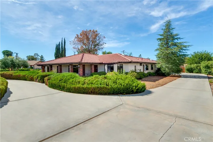 Welcome To Your New Home! Circular Drive to the left and driveway to garages on right.