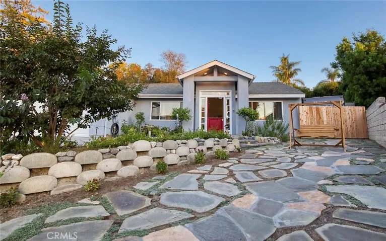Red dutch door, pavers and RV parking