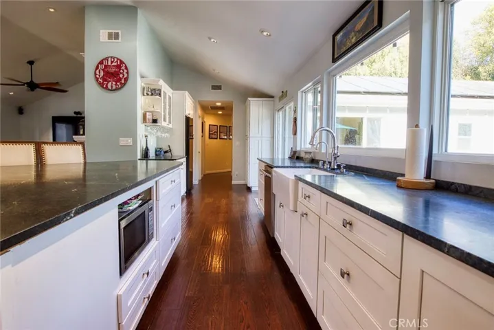 Farmhouse sink and beautiful stone counters