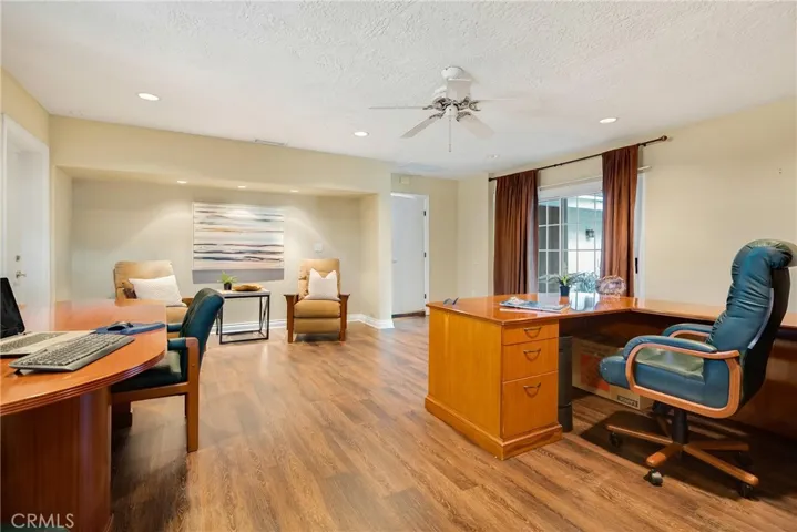 Off the kitchen, this add on garage conversion has sliding glass door, separate exit, 3/4 bath