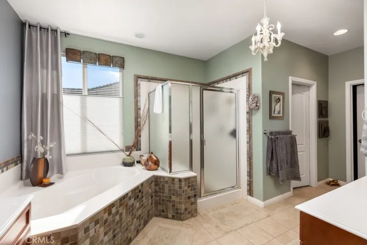 Master bathroom with garden tub, walk-in shower with seating, dual sinks and quite a bit of tile upgrades