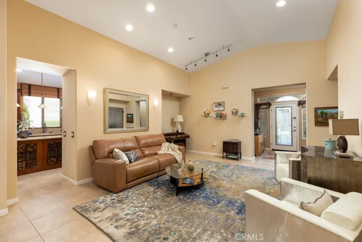 Living room and entry area taken from dining room - kitchen is on the left