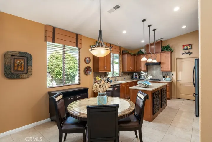 Kitchen with plenty of room for table/chairs - refrigerator on the right stays with the purchase of the home