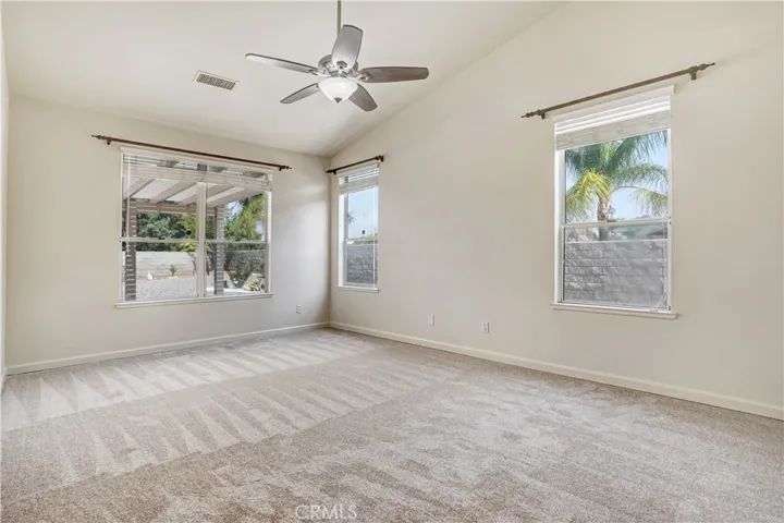 Master bedroom with ceiling fan.