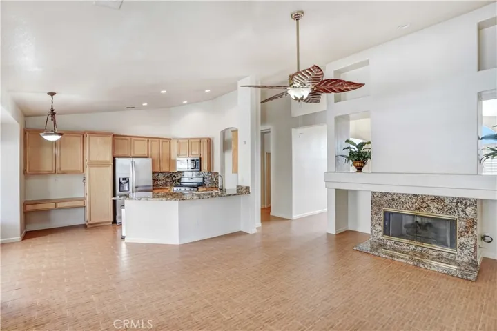 Tiled fireplace with gas log set in family room